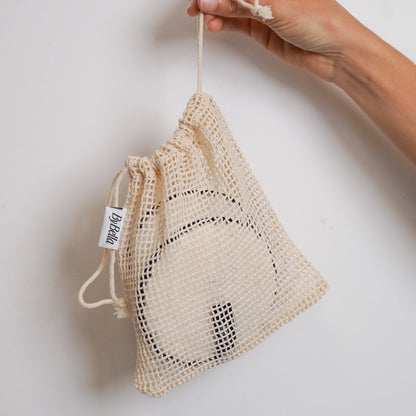 Cleansing clouds in laundry bag. Front view 